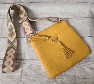 yellow crossbody purse with guitar strap