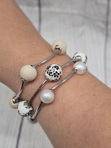 3 piece stretchy bracelet with white floral beads