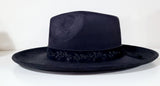 black fedora with flower band